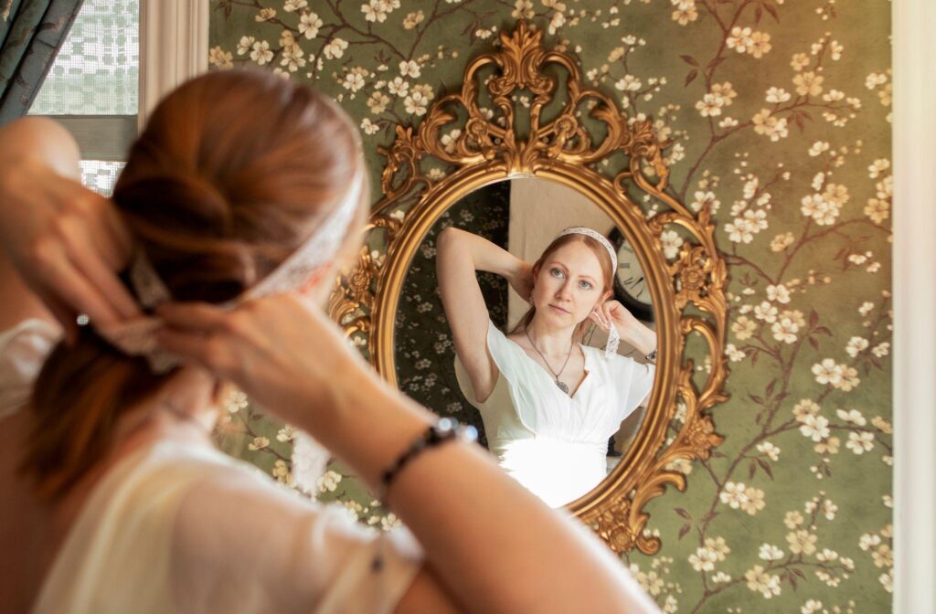 100+ Wedding Photography ideas to capture every moment 99 Bride looking into antique mirror