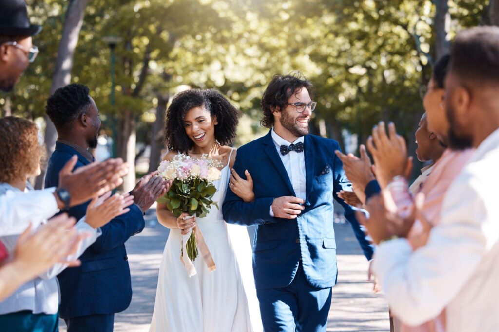 100+ Wedding Photography ideas to capture every moment 76 Couple Walking Through Applauding Guests
