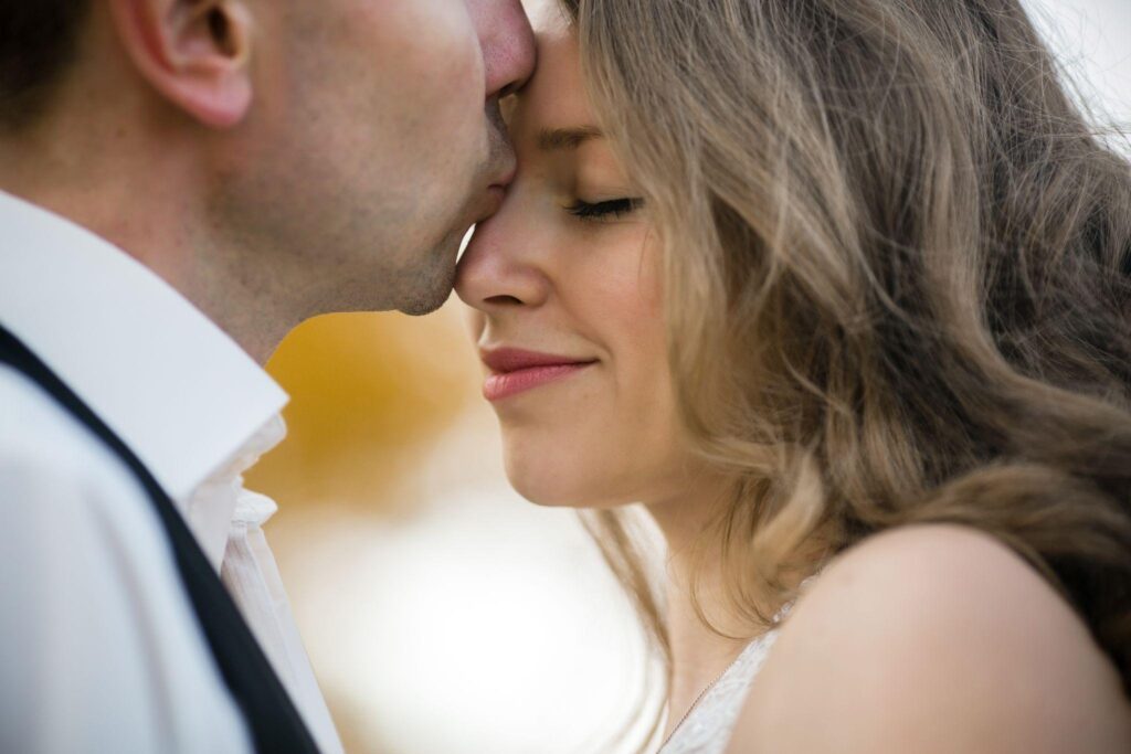 100+ Wedding Photography ideas to capture every moment 43 Groom kissing bride’s forehead