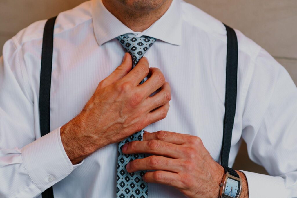 100+ Wedding Photography ideas to capture every moment 2 The groom fixing his tie or cufflinks