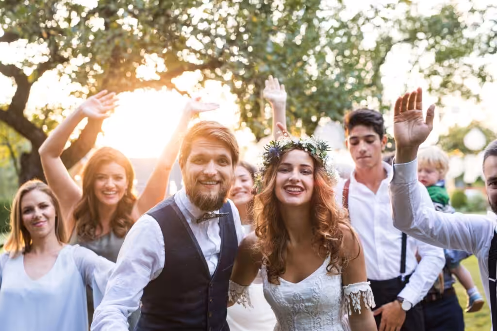 100+ Wedding Photography ideas to capture every moment 76 Everyone Cheering the Couple Post-Ceremony