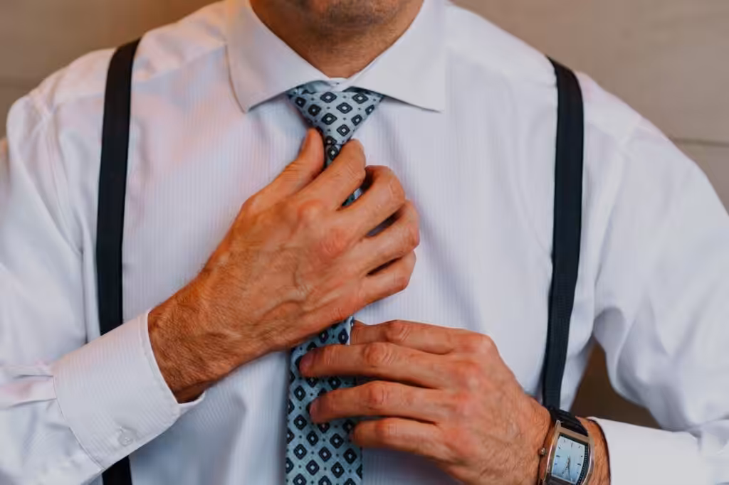 100+ Wedding Photography ideas to capture every moment 3 The groom fixing his tie or cufflinks