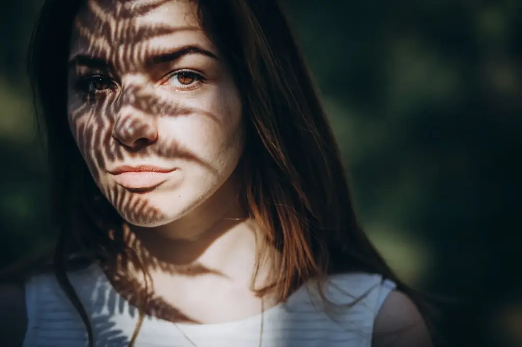 100+ Portrait Photography Ideas for Every Occasion and Style 111 Light and shadow play on the face