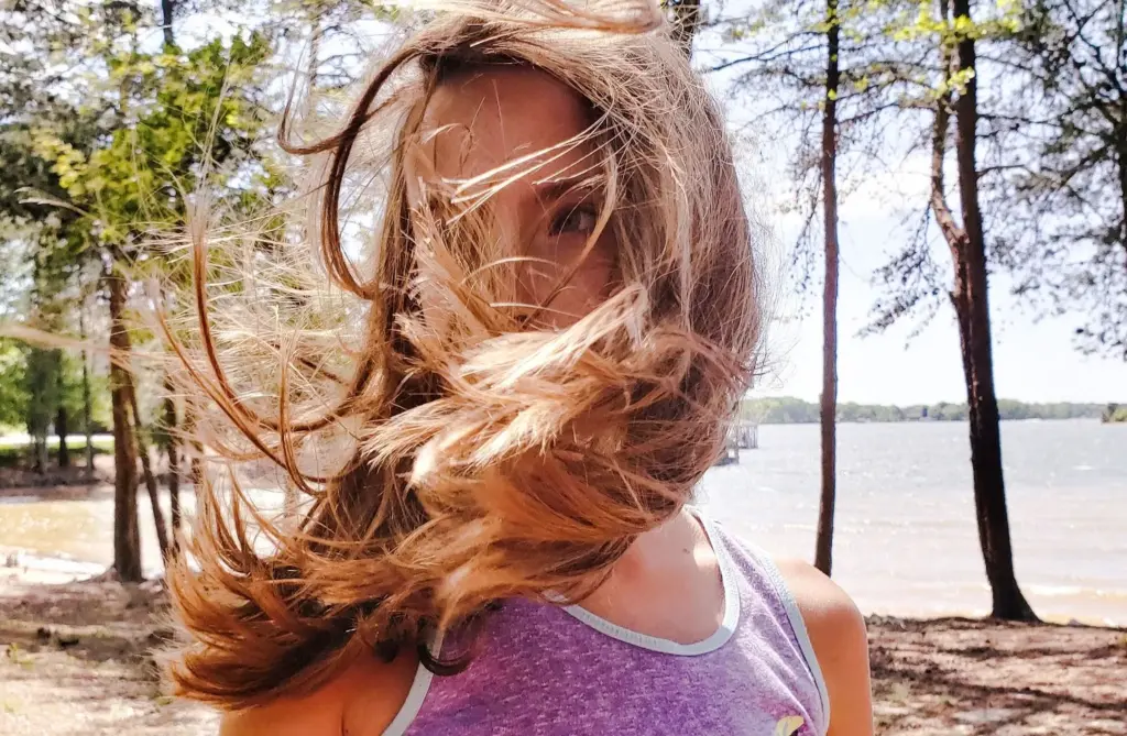 100+ Portrait Photography Ideas for Every Occasion and Style 92 Messy hair, real-life vibes