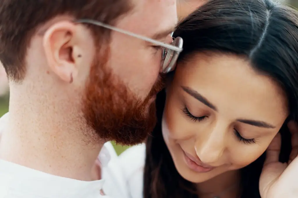 100+ Portrait Photography Ideas for Every Occasion and Style 102 One partner whispers to the other