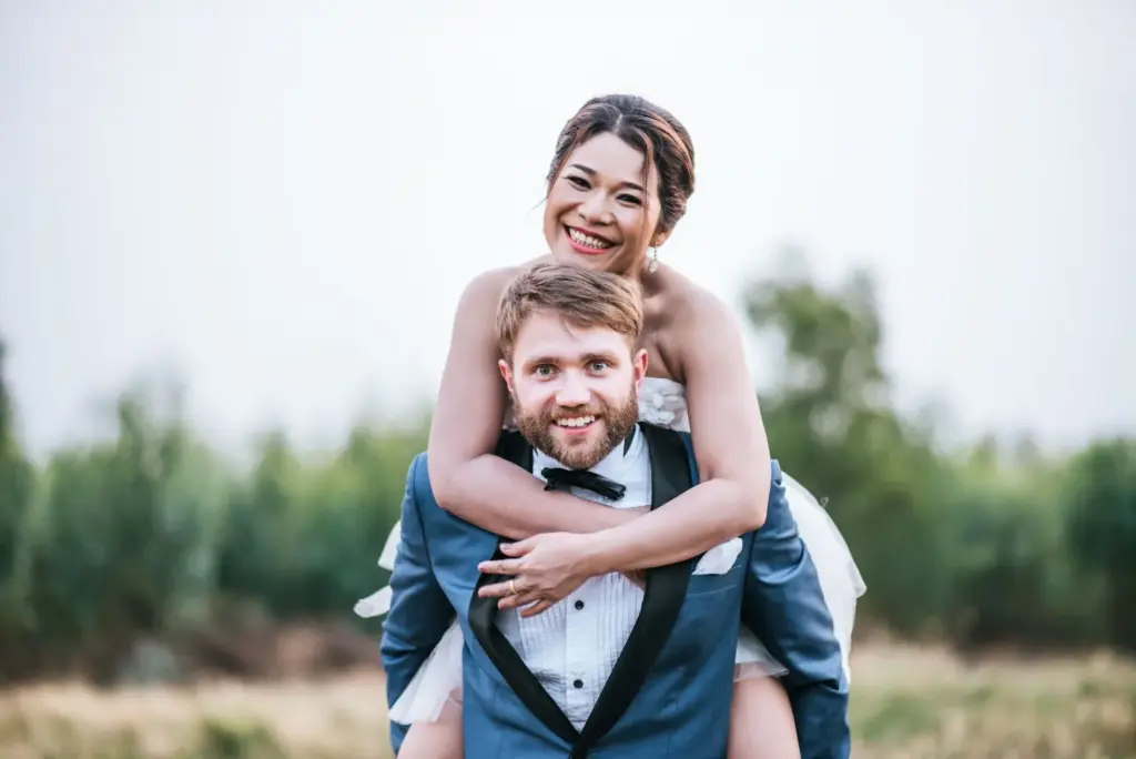 100+ Portrait Photography Ideas for Every Occasion and Style 97 Piggyback ride laughing out loud shot