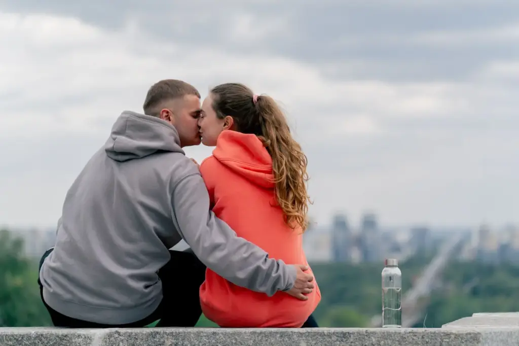 100+ Portrait Photography Ideas for Every Occasion and Style 100 Sitting on a rooftop and kissing