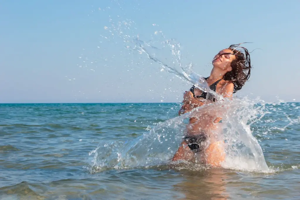 100+ Portrait Photography Ideas for Every Occasion and Style 55 Splashing the beach water