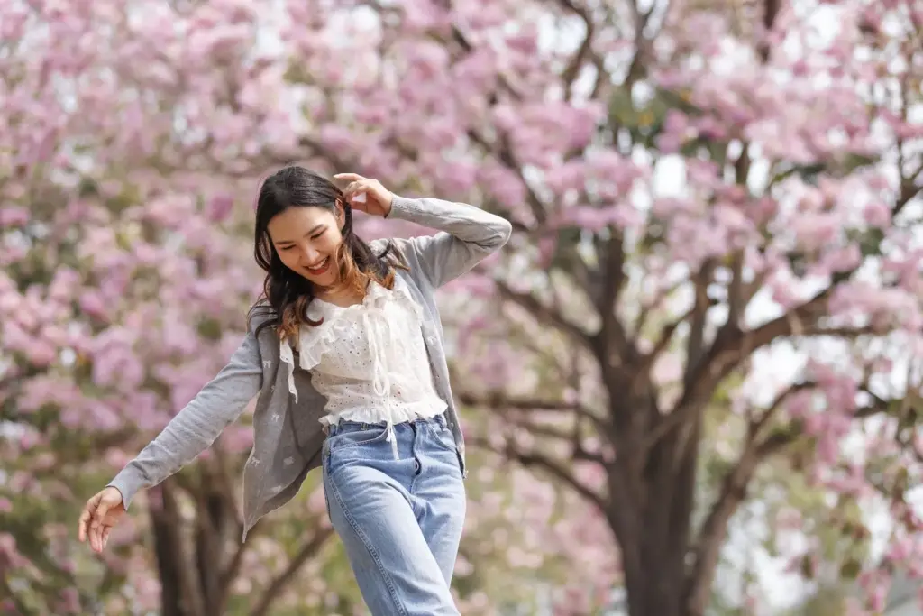 100+ Portrait Photography Ideas for Every Occasion and Style 48 Twirling under spring blossoms