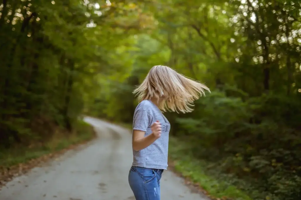 100+ Portrait Photography Ideas for Every Occasion and Style 50 Walking along a windy trail