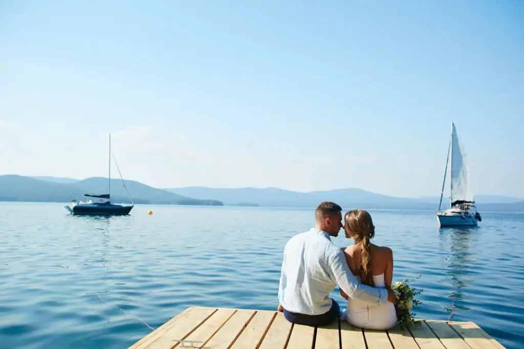 A romantic boat or dock shot by a lake or beach