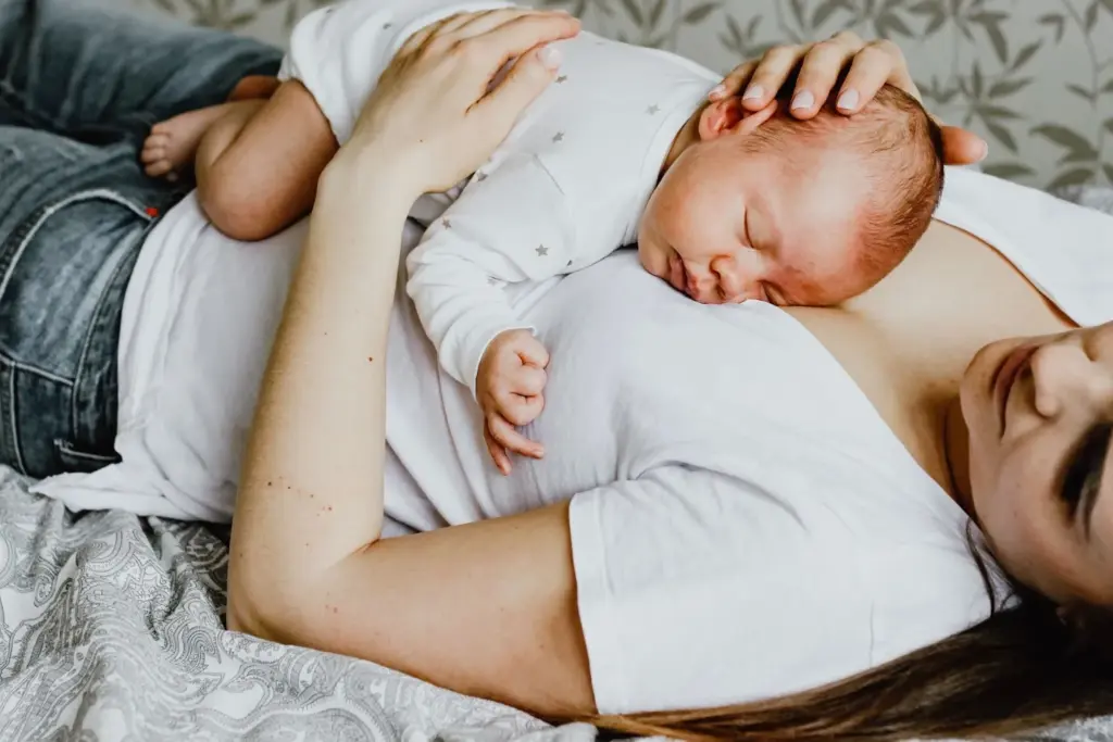 Baby lying peacefully on mom’s chest