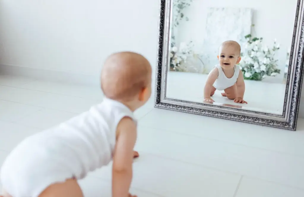 Baby on the mirror surface