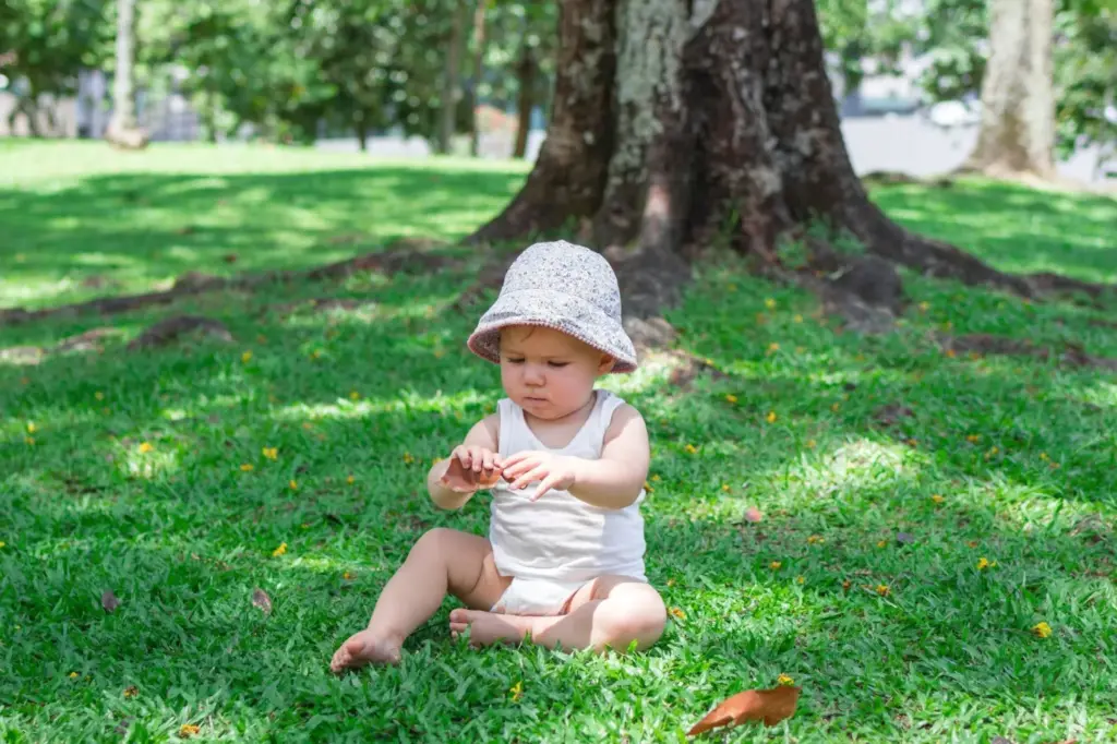 Baby under a tree canopy