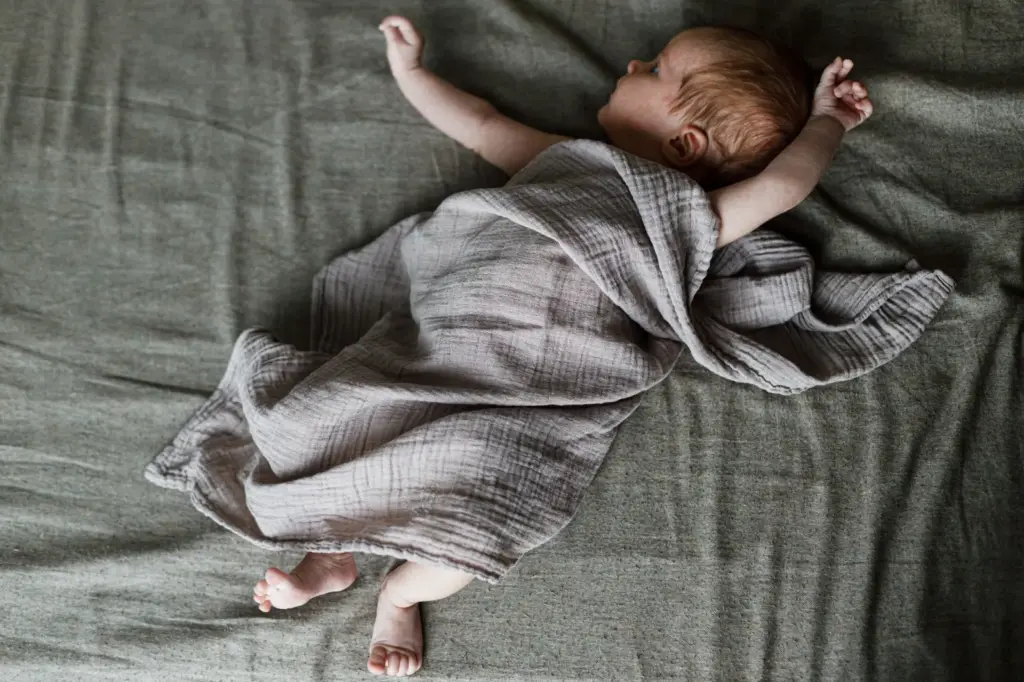 Baby wrapped in a cultural blanket