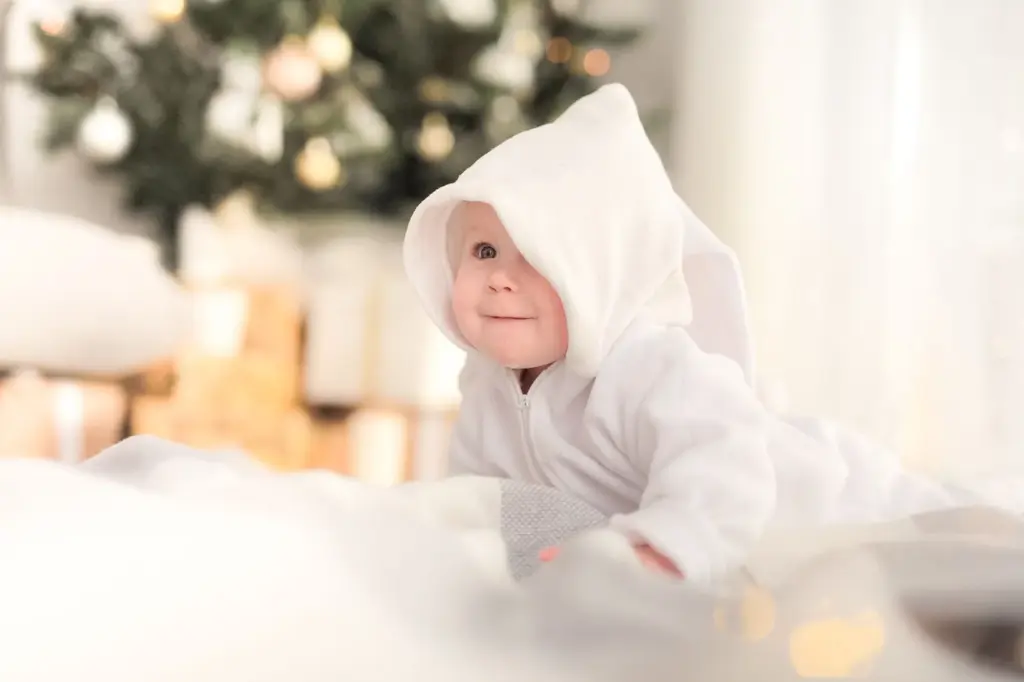 Baby wrapped in his winter snowflake blanket