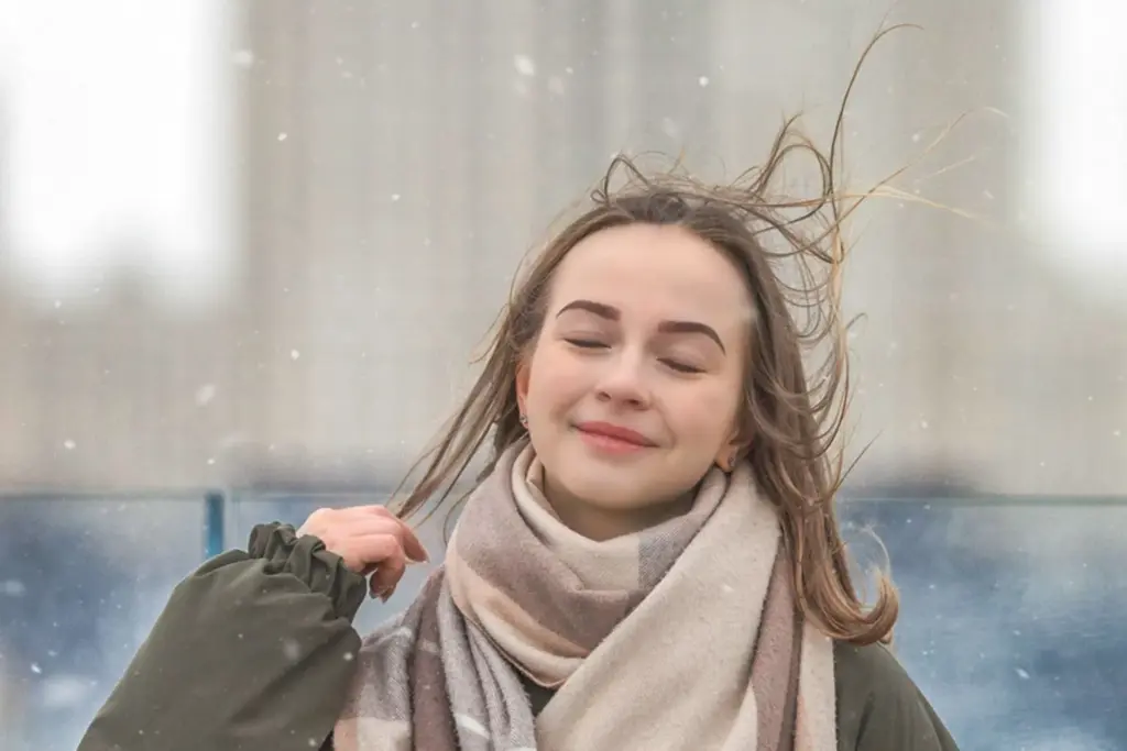 Breathing in cold air and smiling