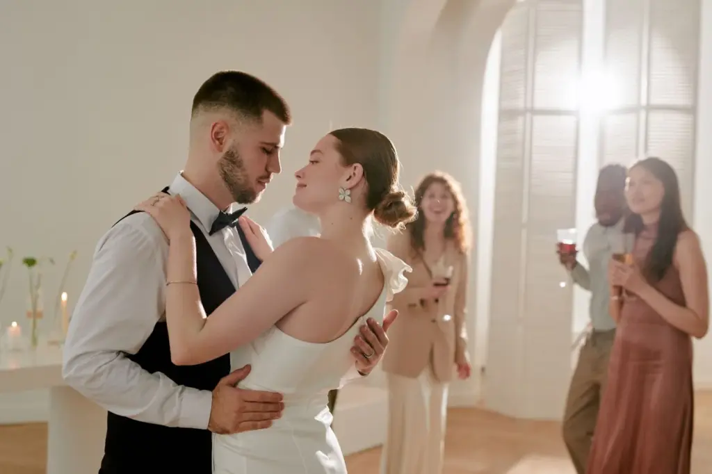 Bride and groom sharing a cheeky smile during the dance