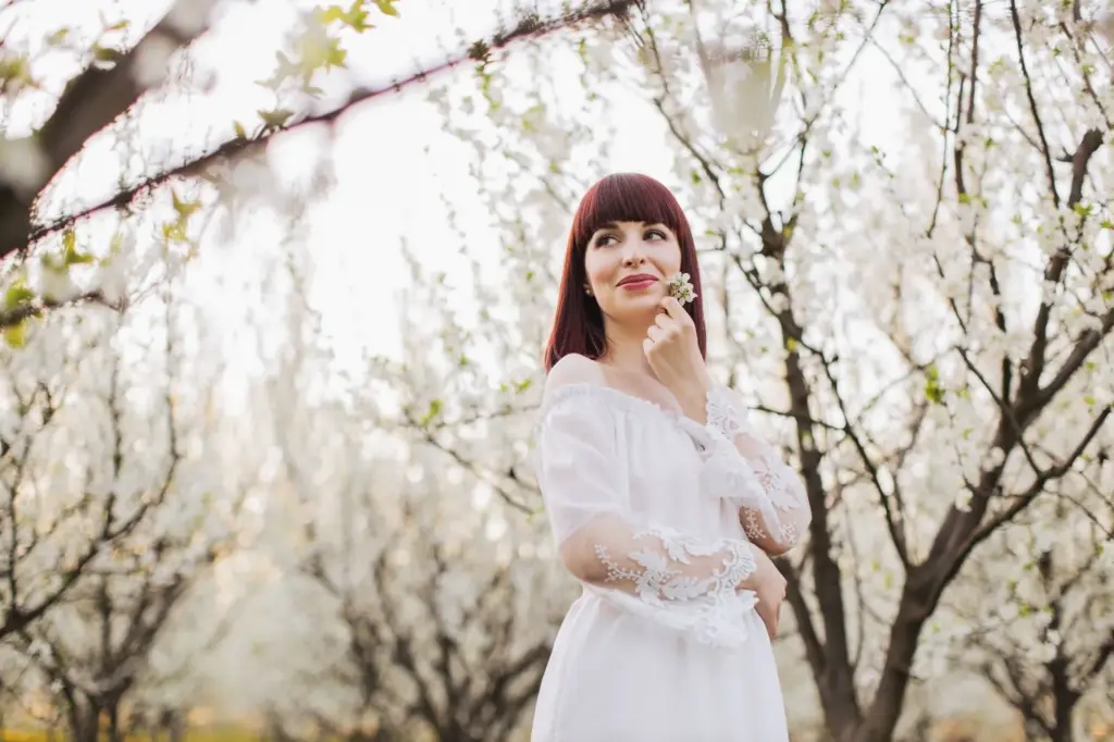 Bride dressed up under the cherry blossom