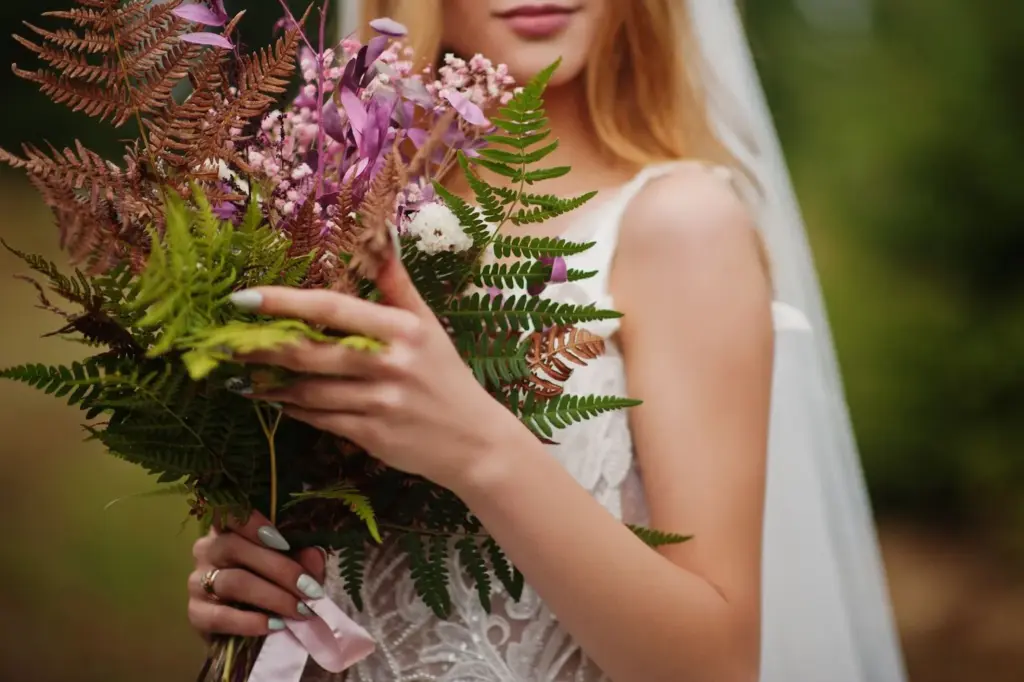 Bride holding a wildflower bouquet