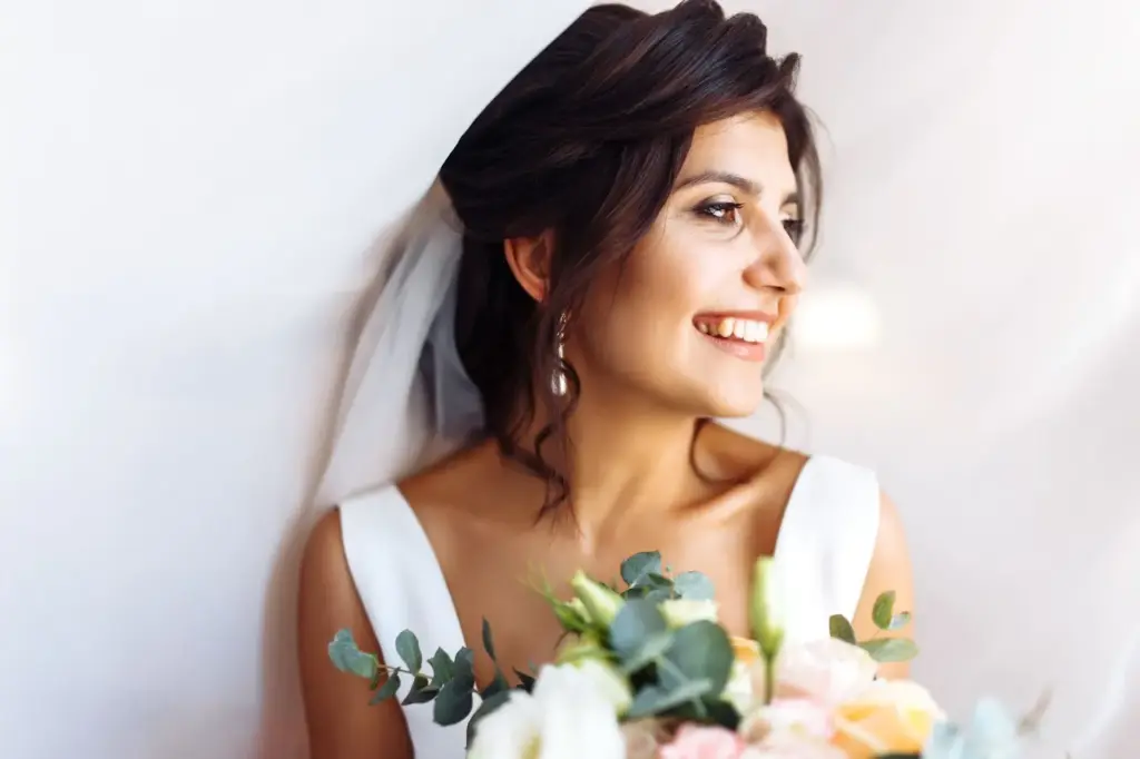 Bride smiling softly while listening