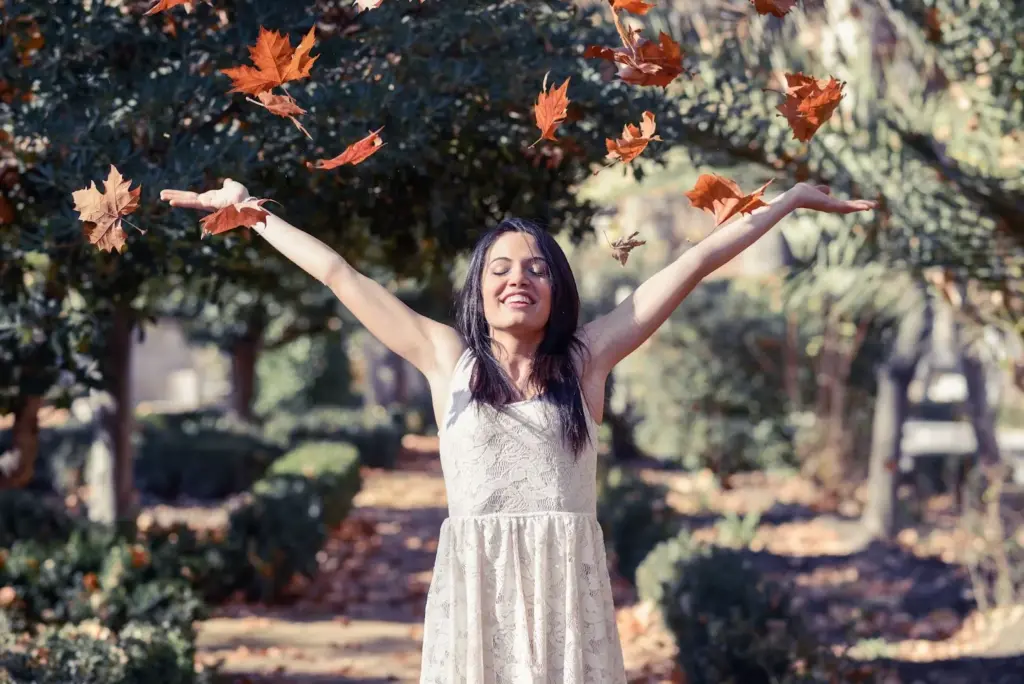 Bride tossing leaves in the air