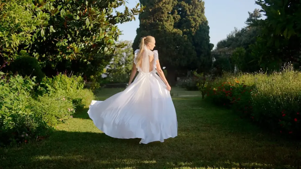Bride twirling in the sunlight with flowing dress