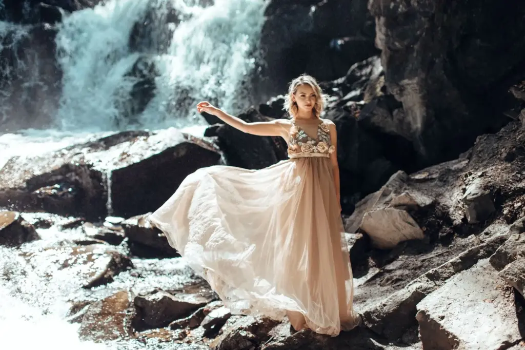 Bride walking barefoot near the falls
