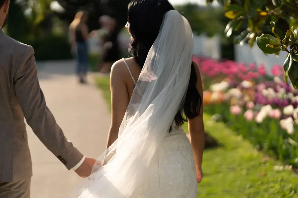Bride walking down a flower path