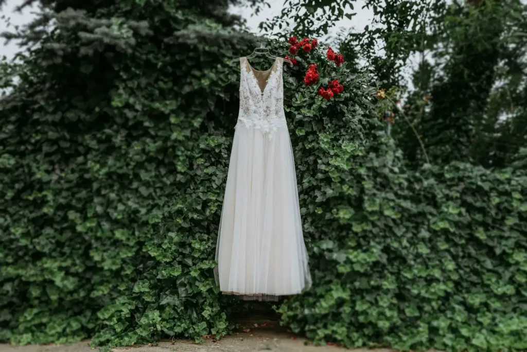 Bride’s dress flowing with leaves