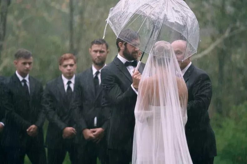 Bride’s veil wet with raindrops