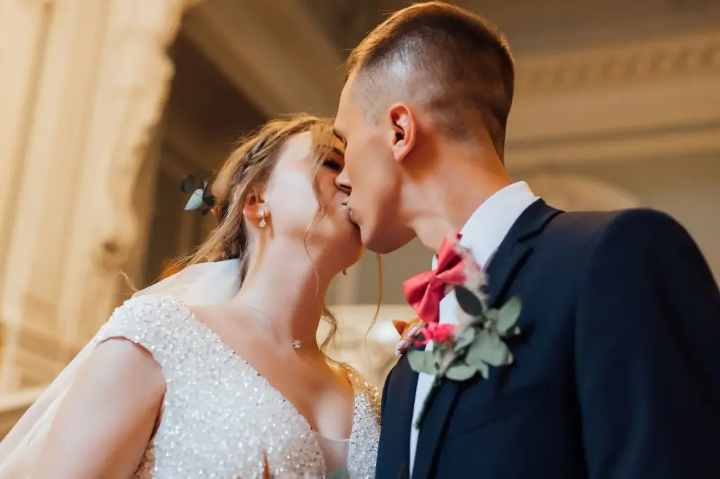 Close-up of a heartfelt kiss goodbye