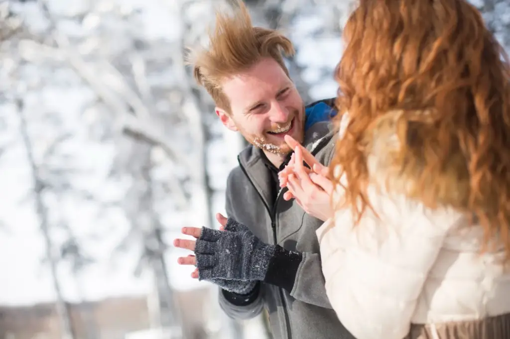 Candid laughter during a snowball fight