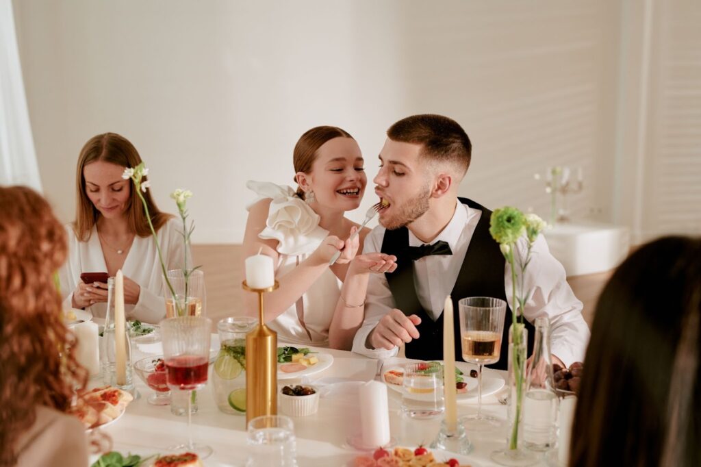 Candid laughter while feeding each other snacks