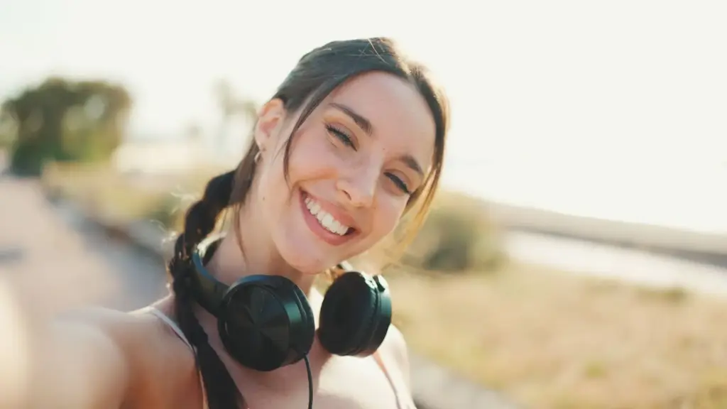 Candid smile with headphones on
