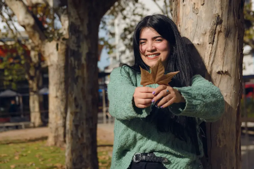 Candid smiling shot while holding a leaf