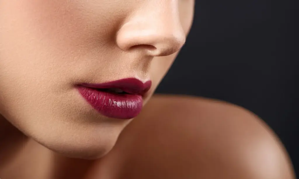 Close-up focusing on bold lip color