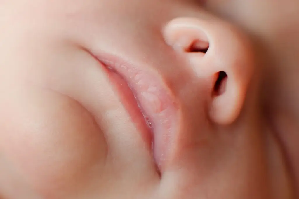Close-up of baby’s lips while peacefully sleeping