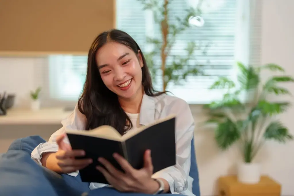 Complete focus on the smile and blur on books or plants