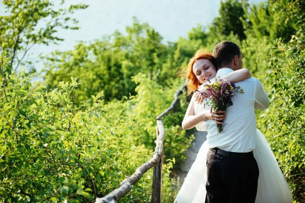 Couple hugging after a hike