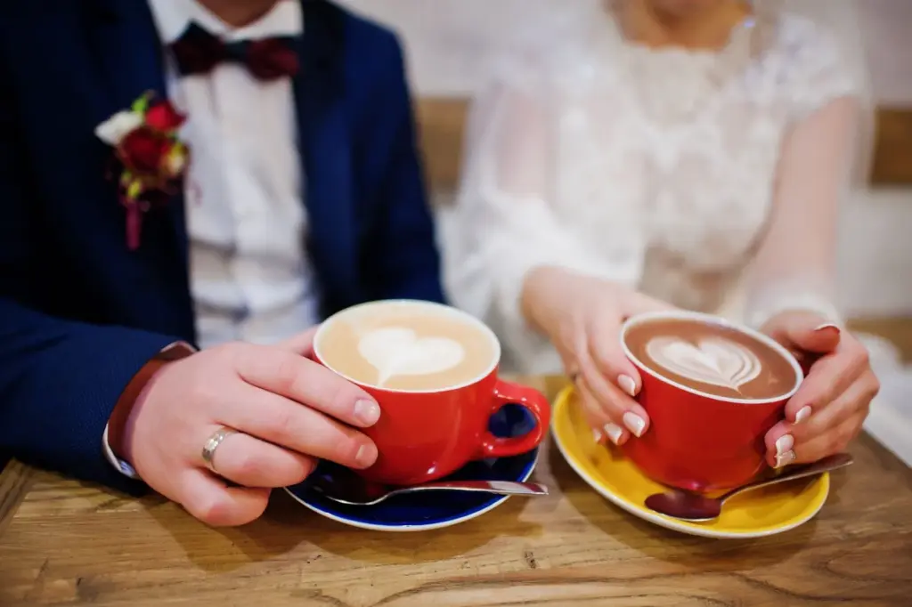 Couple sharing a hot cappuccino