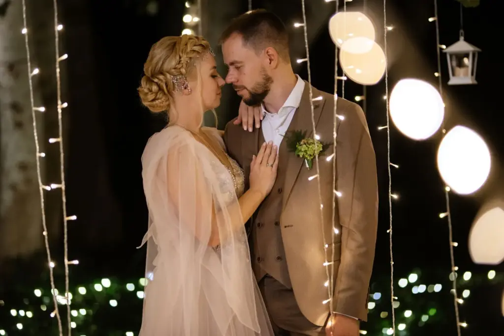 Couple wrapped in fairy lights