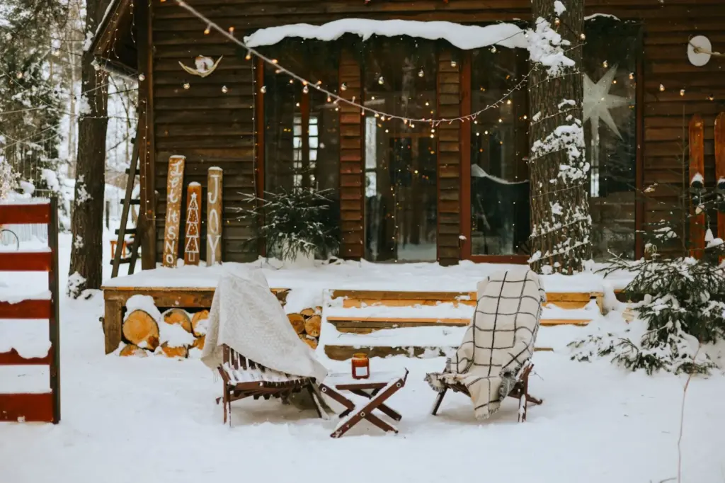 Cozy cabin porch cuddle with snow falling