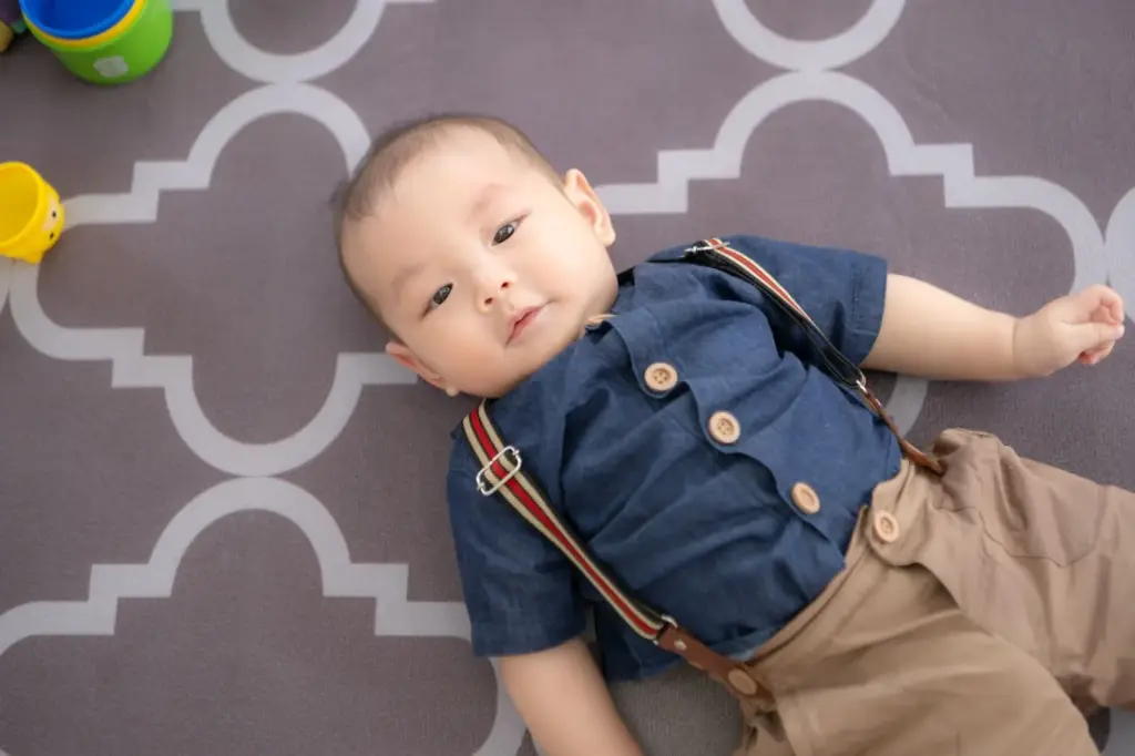 Dressed like a little gentleman in suspenders and bow tie