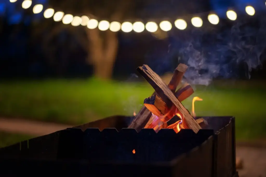 Fire pit glows with a starry background