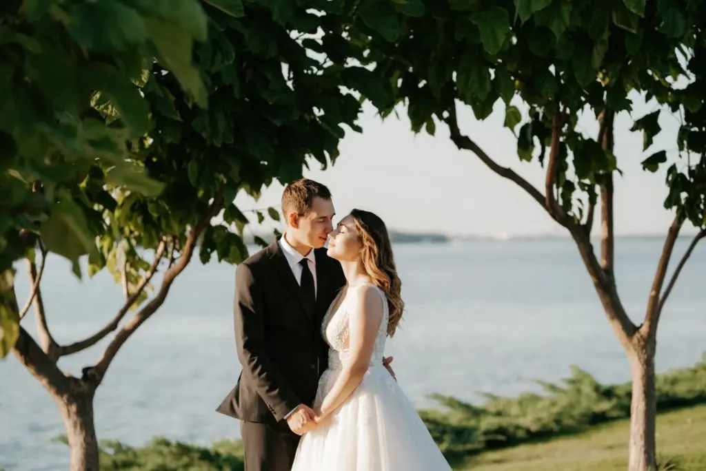 First look under trees with the lake in the background