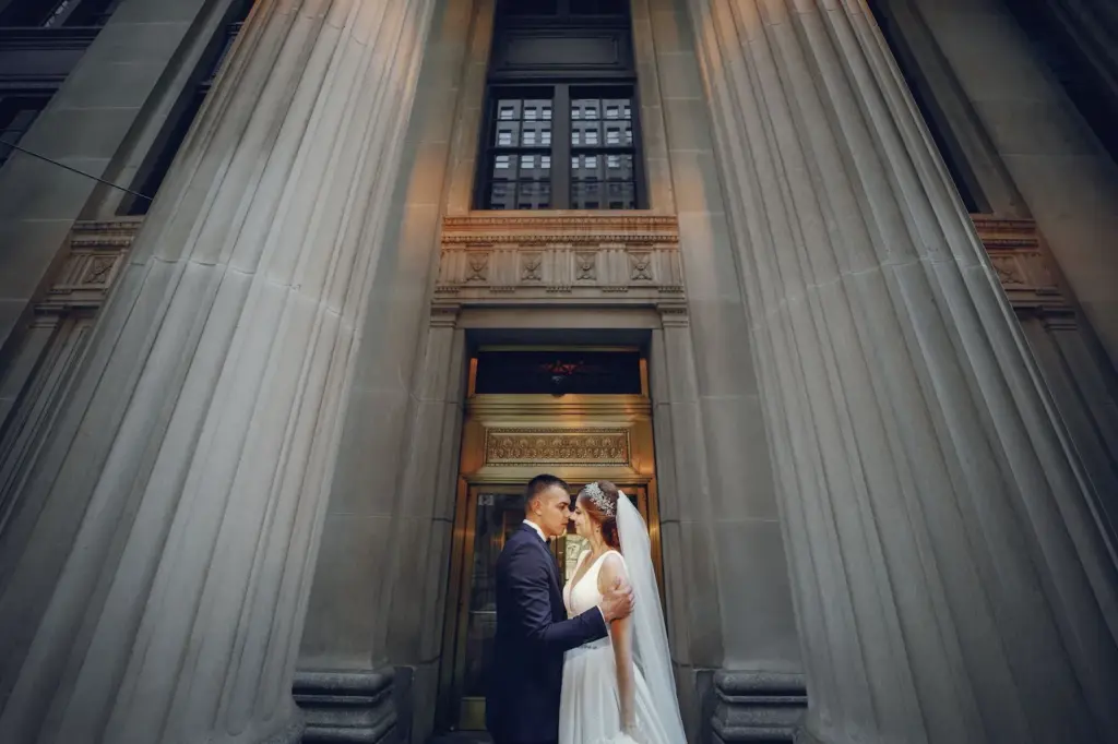 Framed between large palace door panels