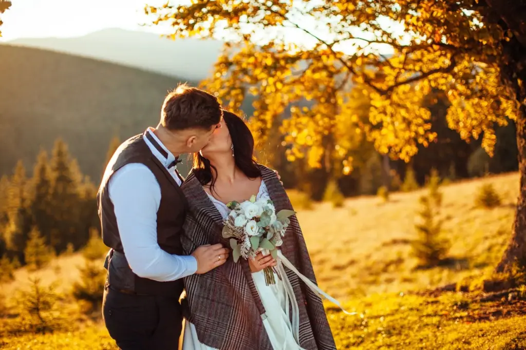 Golden hour kiss with fall trees