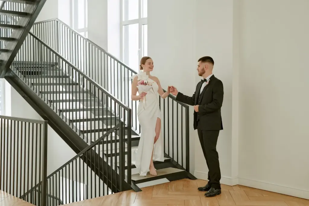 Groom reaching out as she approaches