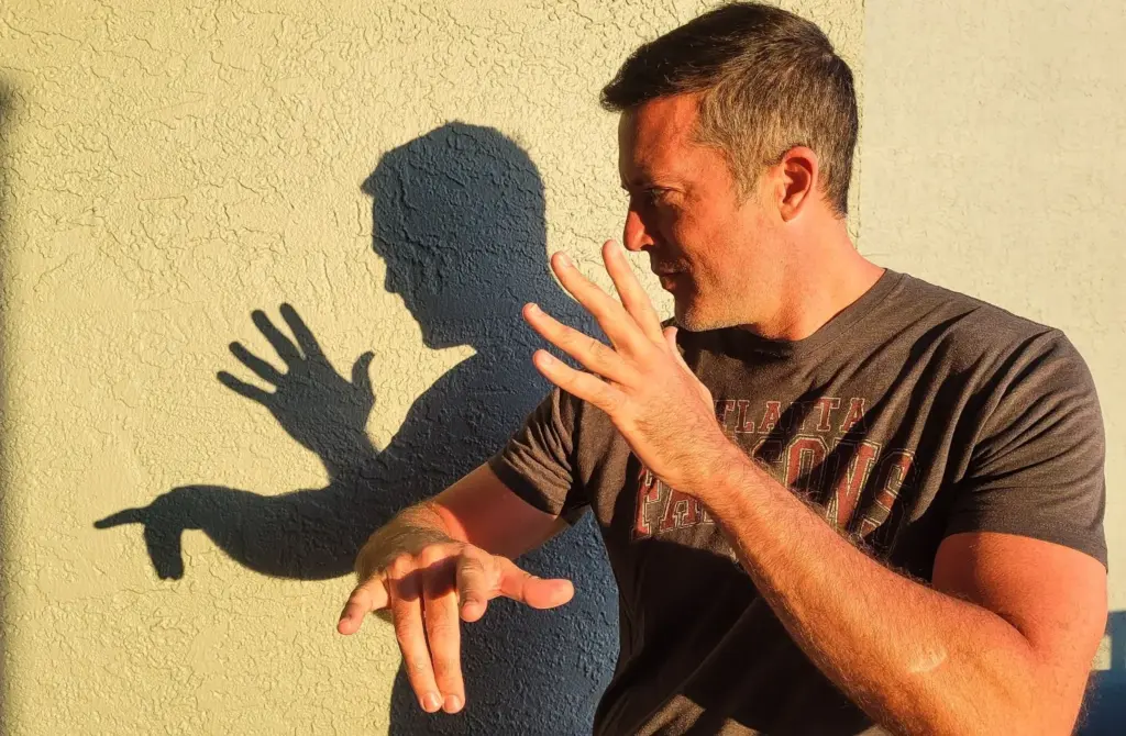 Hands creating shadow patterns